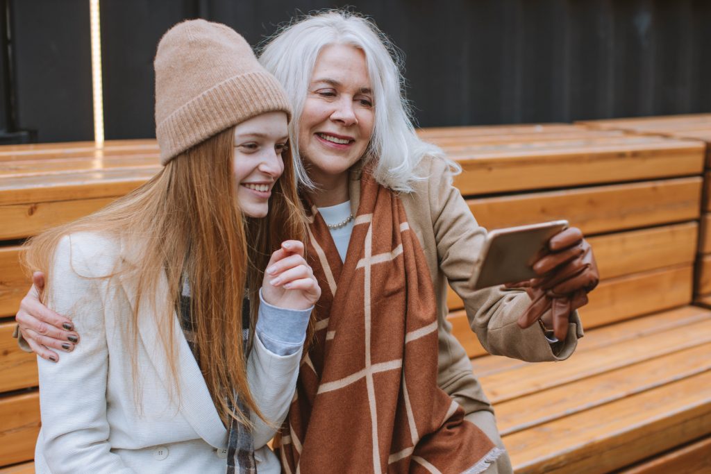 Grandmother and teenager taking a selfie