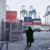 Unrecognizable man standing in cargo port