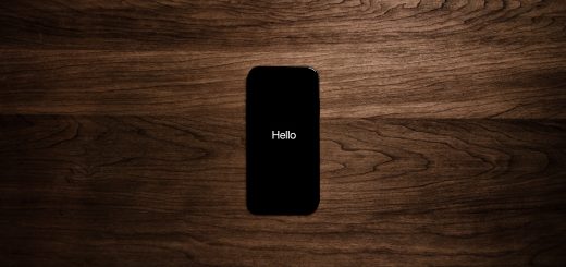 Turned on black iphone 7 displaying hello