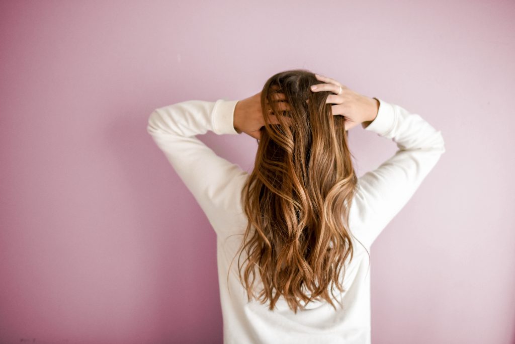 Woman wearing white long sleeved shirt