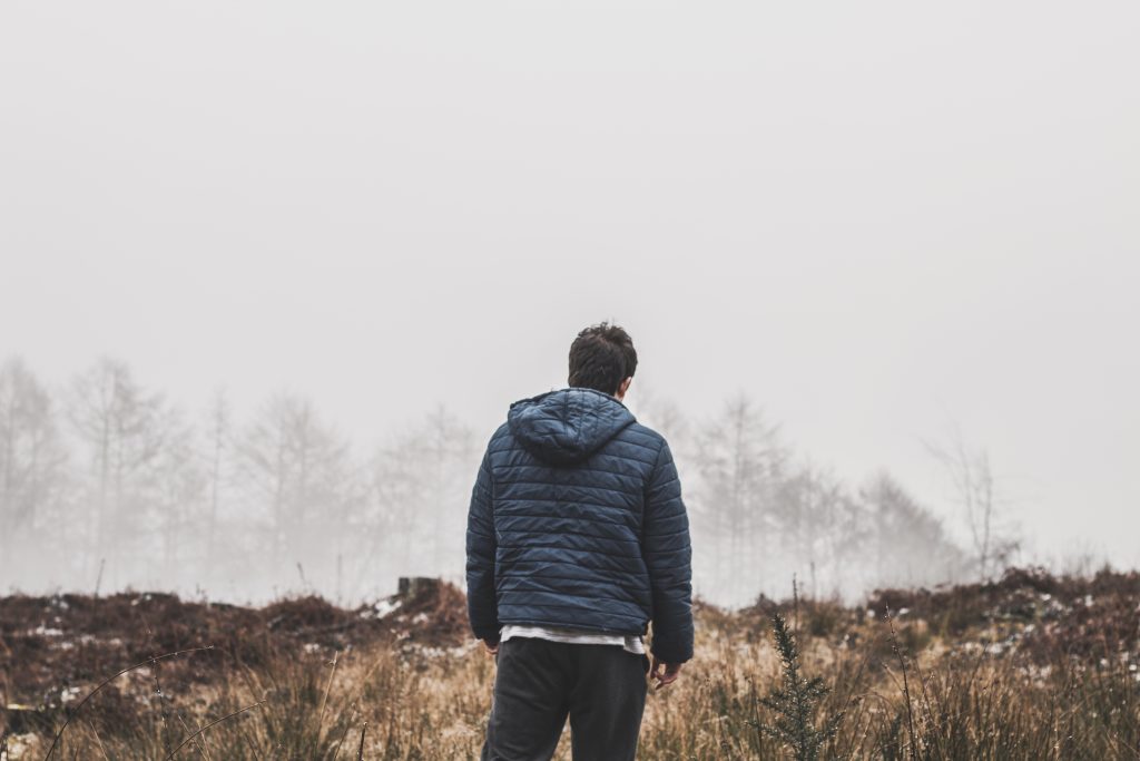 Man wearing blue bubble hooded jacket