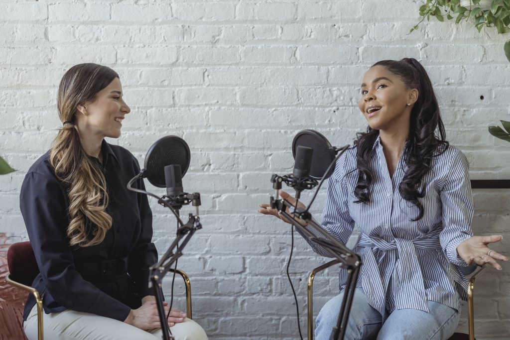 Positive black woman talking to radio host