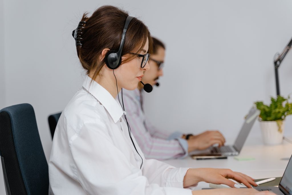 Side view of woman working as a call center agent