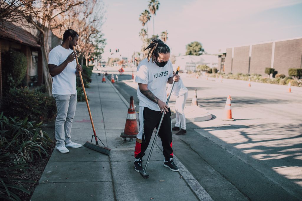 Men cleaning the street