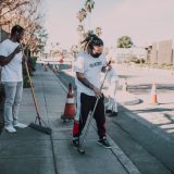 Men cleaning the street